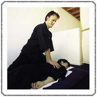 woman receiving shiatsu massage treatment